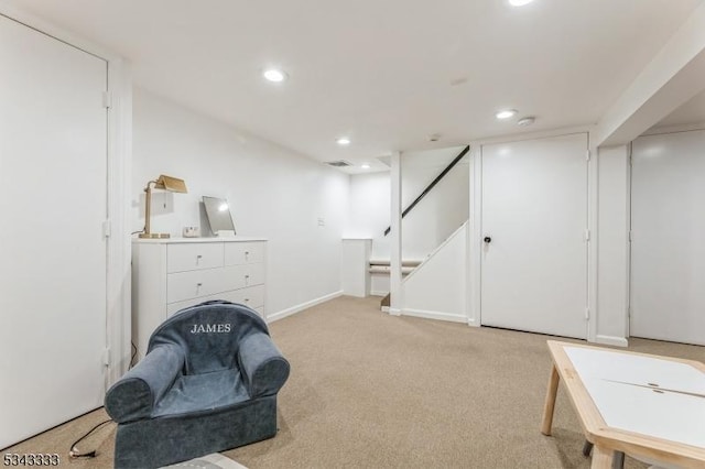 living area with stairway, baseboards, visible vents, recessed lighting, and light carpet