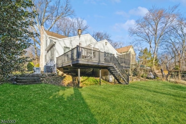 back of house with stairway, a chimney, a yard, and a deck