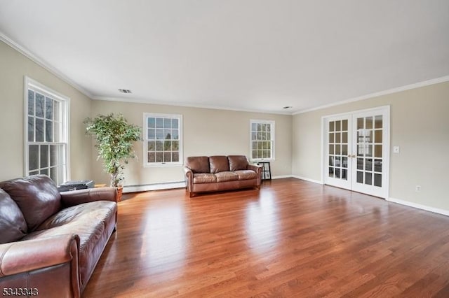 living room featuring visible vents, french doors, a baseboard heating unit, and wood finished floors