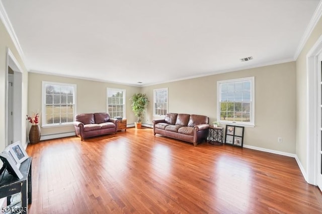 unfurnished living room featuring visible vents, a healthy amount of sunlight, crown molding, and wood finished floors