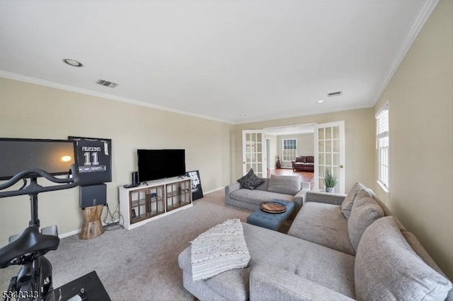 carpeted living room with french doors, baseboards, visible vents, and crown molding