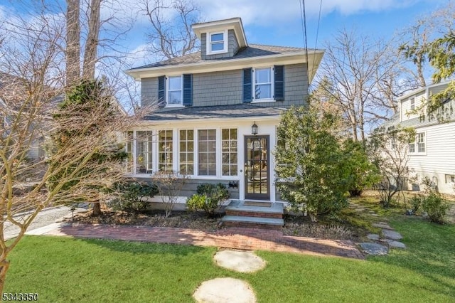 traditional style home with a front yard