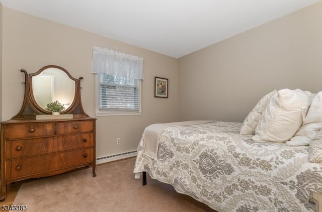 carpeted bedroom with baseboard heating