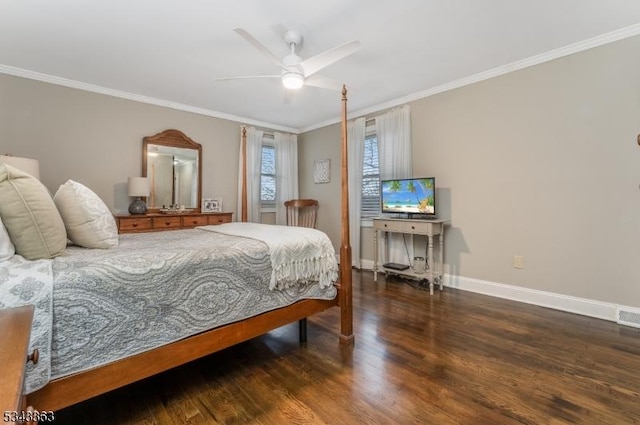 bedroom with ornamental molding, baseboards, and wood finished floors