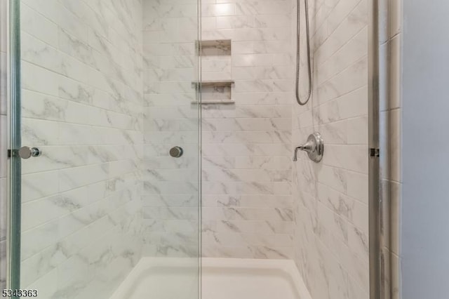 bathroom with a shower stall