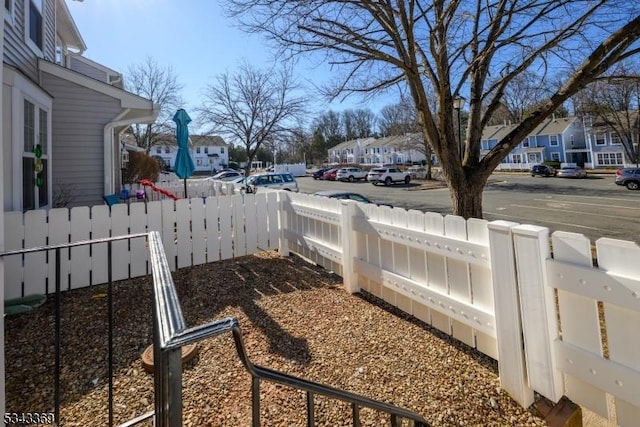 view of yard with a residential view and a fenced backyard