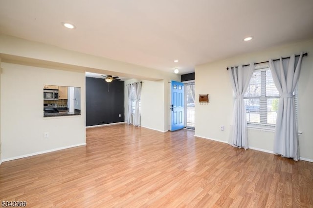 unfurnished living room with recessed lighting, baseboards, light wood-type flooring, and ceiling fan