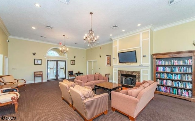 living room featuring visible vents, crown molding, a glass covered fireplace, and carpet floors