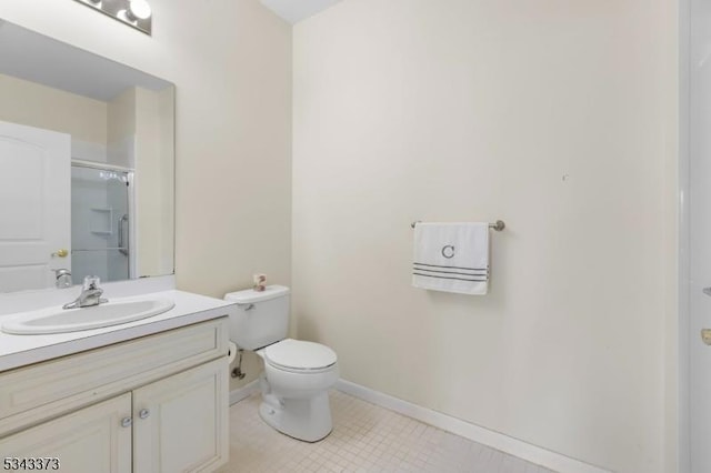 full bath featuring a shower with shower door, tile patterned floors, toilet, baseboards, and vanity