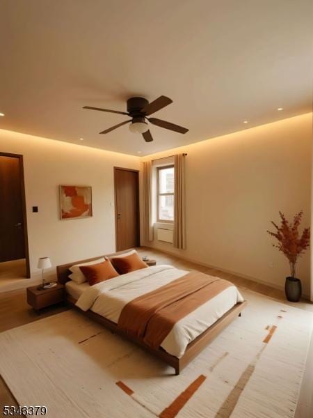 bedroom featuring baseboards and a ceiling fan