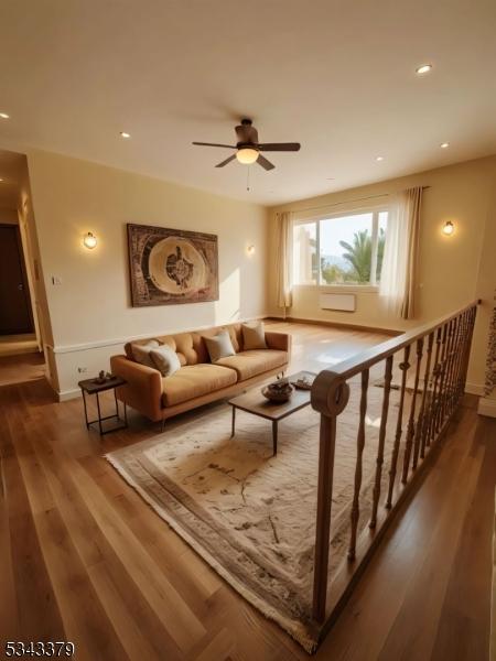 living room with a ceiling fan, recessed lighting, wood finished floors, and baseboards