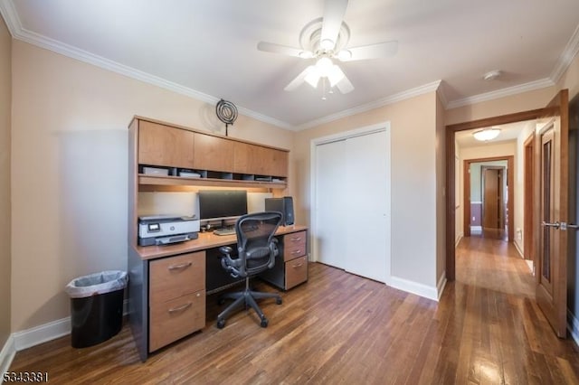 office featuring baseboards, a ceiling fan, wood finished floors, and crown molding