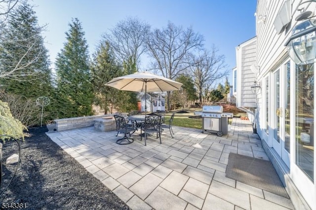 view of patio / terrace featuring area for grilling and outdoor dining area