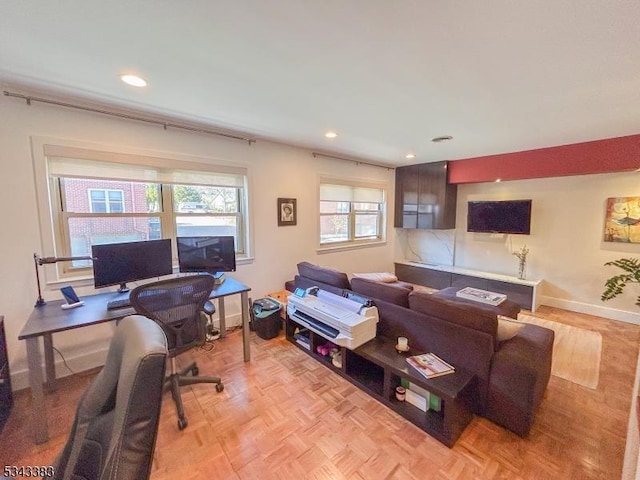 living area with recessed lighting and baseboards