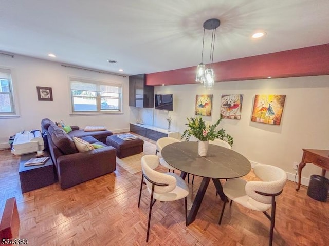 dining space featuring recessed lighting and baseboards