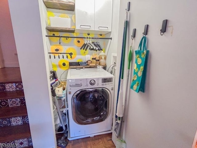 laundry room featuring washer / clothes dryer and cabinet space