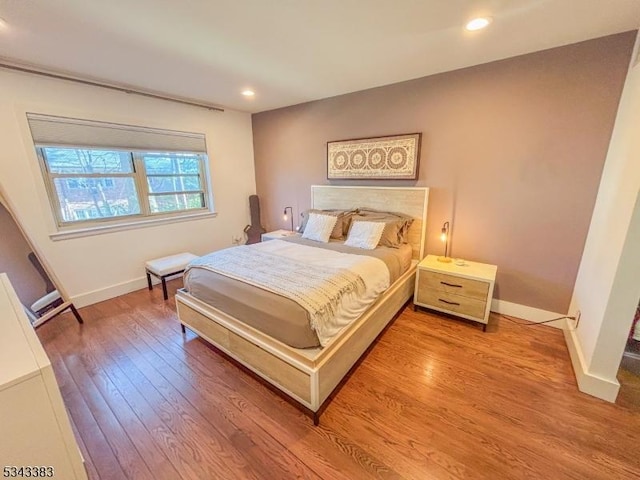 bedroom featuring recessed lighting, baseboards, and wood finished floors