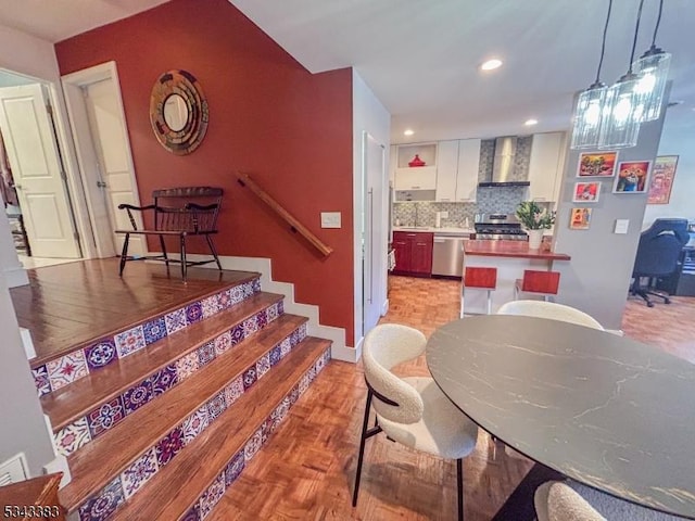 dining area featuring stairway and recessed lighting