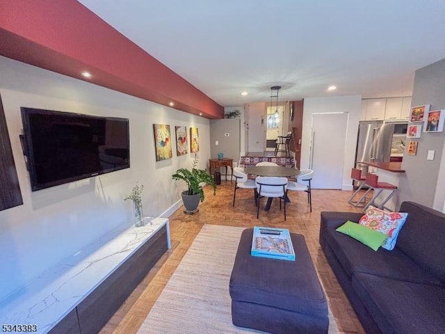 living room featuring recessed lighting and baseboards