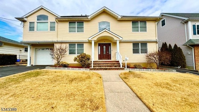 view of front of home featuring driveway and a garage