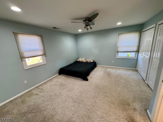 unfurnished bedroom featuring recessed lighting, baseboards, and carpet floors