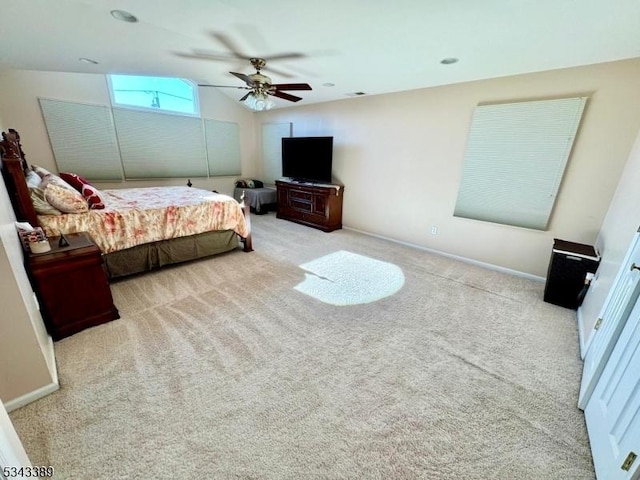 carpeted bedroom with baseboards, lofted ceiling, and a ceiling fan