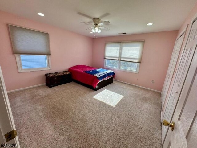 carpeted bedroom with visible vents, recessed lighting, baseboards, and ceiling fan