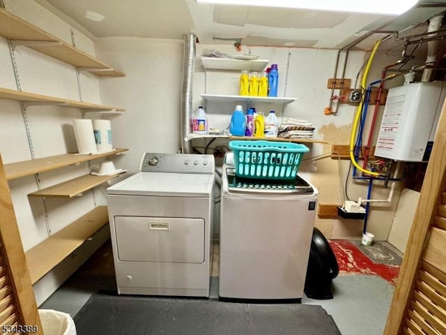 washroom featuring independent washer and dryer and water heater