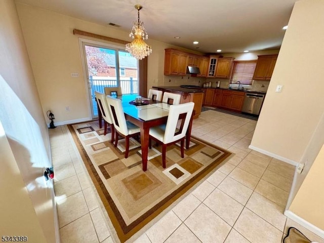 dining area featuring baseboards, visible vents, light tile patterned flooring, recessed lighting, and a notable chandelier