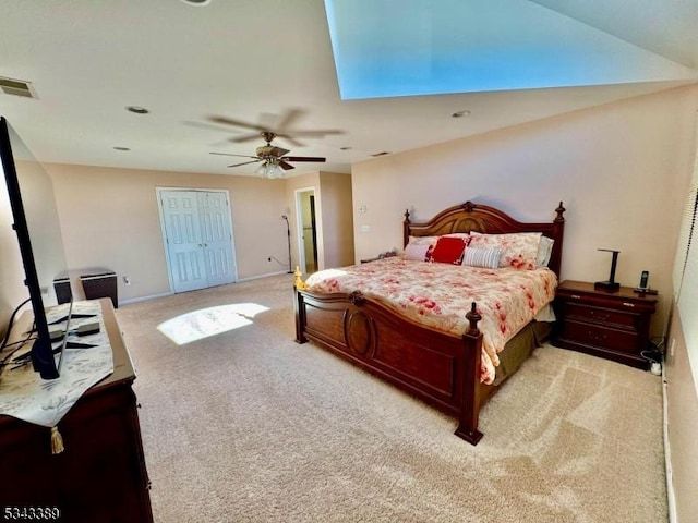 bedroom featuring visible vents, light carpet, baseboards, and ceiling fan