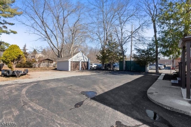 view of street with aphalt driveway