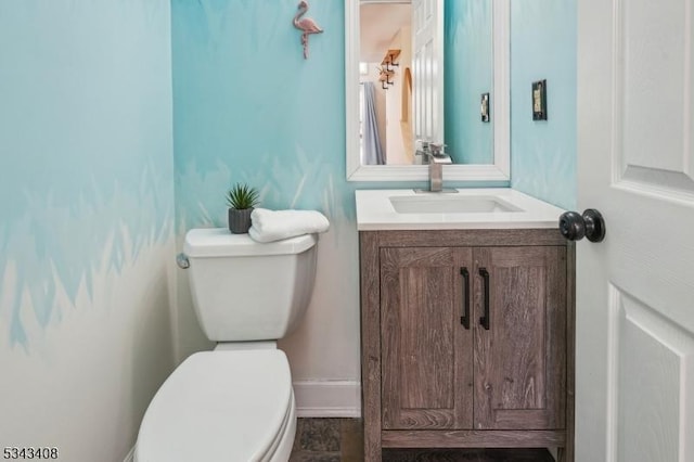 bathroom with toilet and vanity