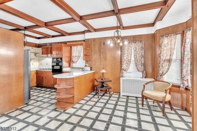 kitchen with brown cabinetry, radiator, stainless steel appliances, and open shelves