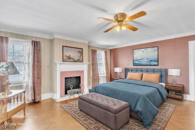 bedroom featuring crown molding, a fireplace with flush hearth, baseboards, and ceiling fan