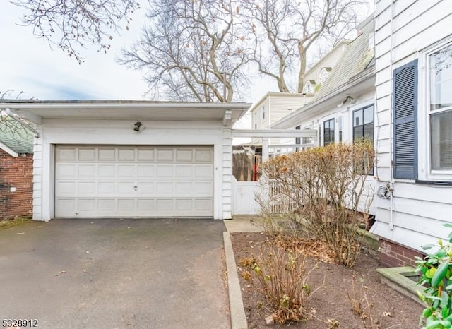 exterior space featuring an attached garage and driveway