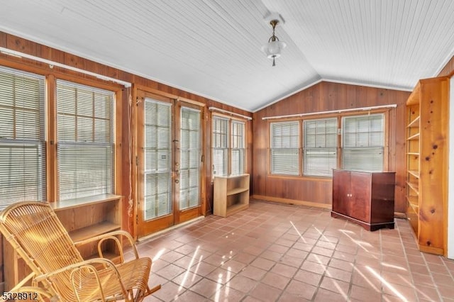 unfurnished sunroom with vaulted ceiling