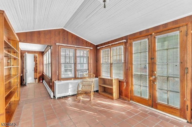 unfurnished sunroom featuring radiator heating unit and vaulted ceiling