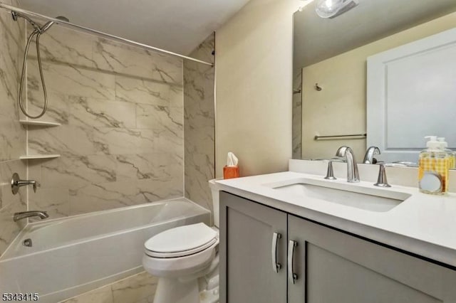 full bathroom with toilet, marble finish floor, shower / washtub combination, and vanity