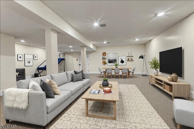 carpeted living area featuring visible vents, recessed lighting, and baseboards