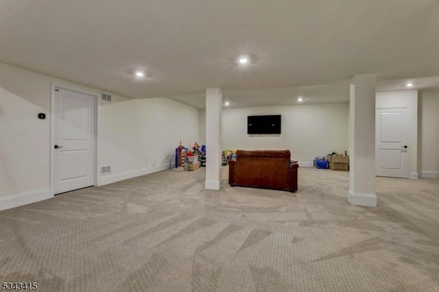 finished basement with recessed lighting, visible vents, baseboards, and light colored carpet