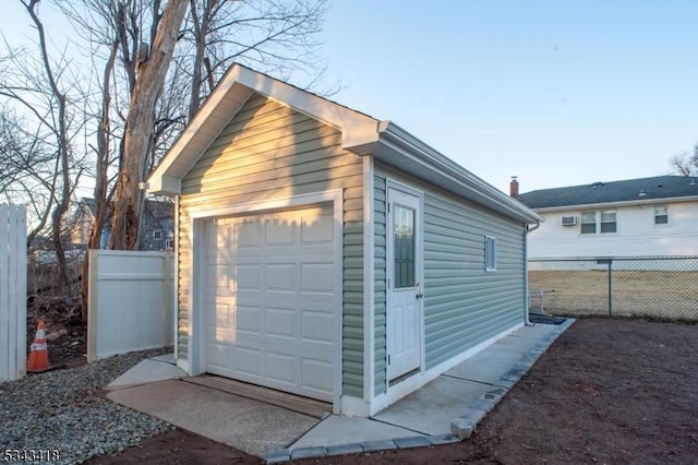 detached garage with fence