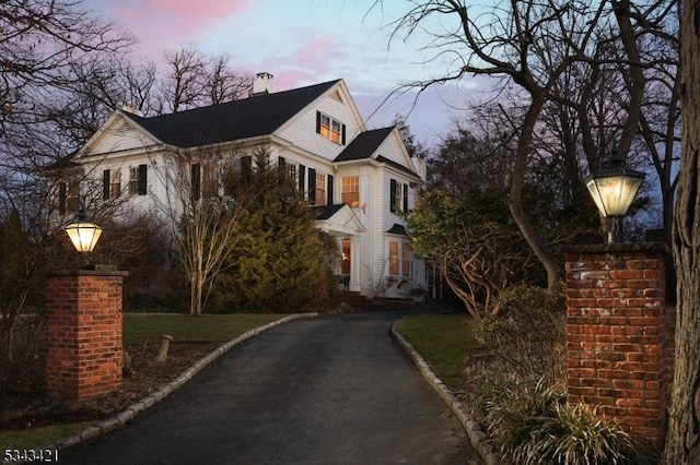 view of home's exterior featuring driveway