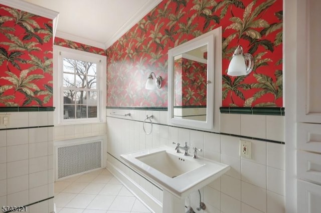 bathroom with radiator, ornamental molding, wainscoting, and wallpapered walls