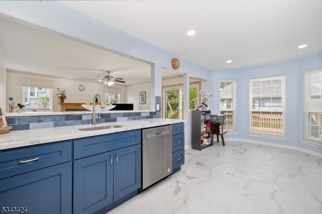 kitchen with dishwasher, a sink, light marble finish floors, light stone counters, and recessed lighting
