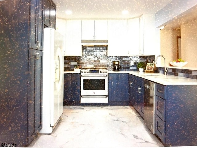 kitchen featuring appliances with stainless steel finishes, a sink, blue cabinets, and white cabinets