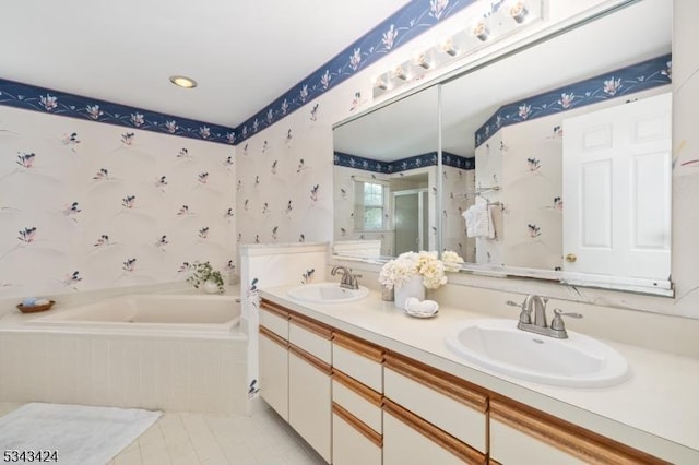 bathroom featuring wallpapered walls, a shower stall, a bath, tile patterned flooring, and double vanity