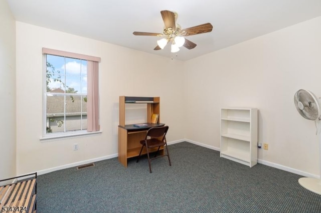 office with dark colored carpet, baseboards, and ceiling fan
