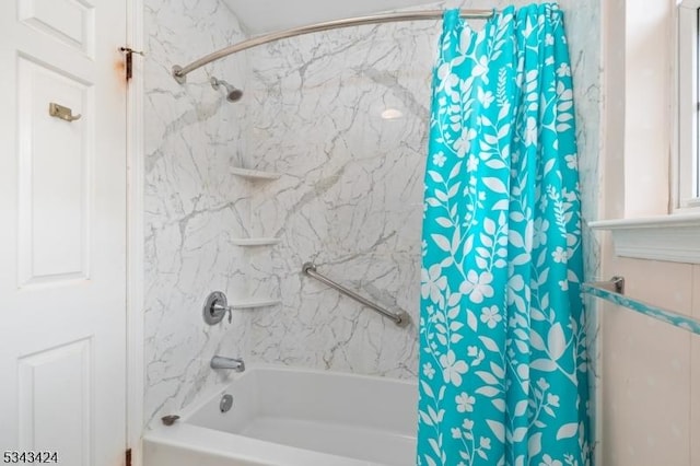 bathroom with shower / tub combination