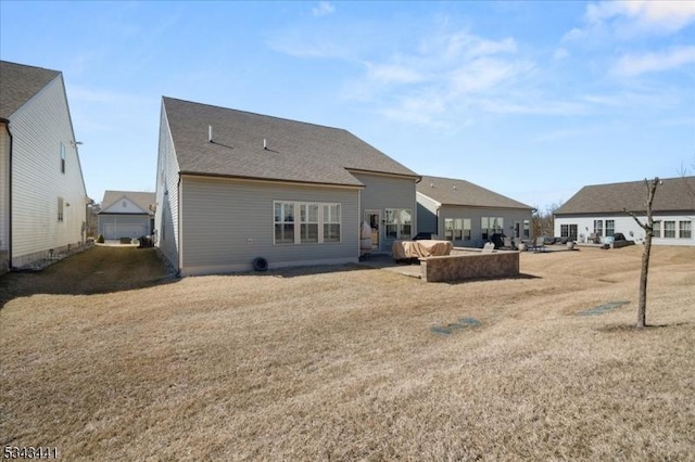 back of property with a patio and a lawn