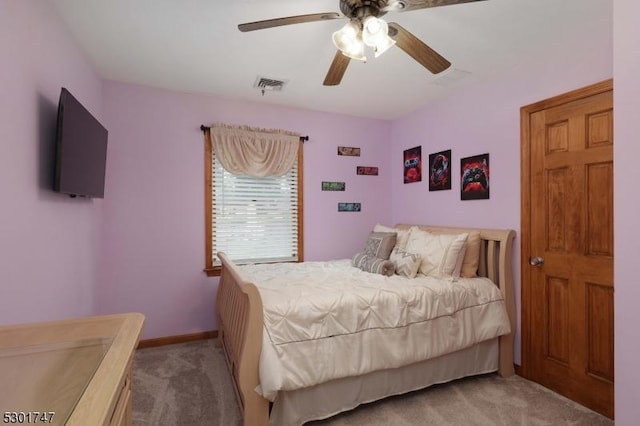 bedroom with visible vents, baseboards, carpet, and ceiling fan